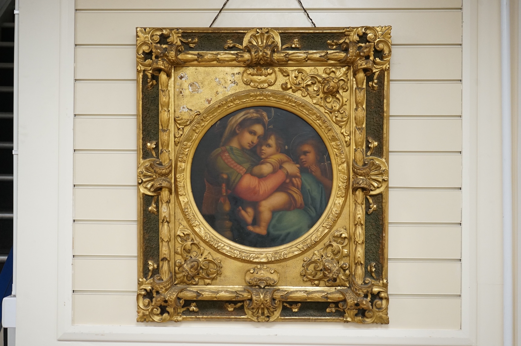 After Raphael (1483-1520), tondo oil on canvas, Madonna and chair, 38cm diameter, housed in ornate gilt frame